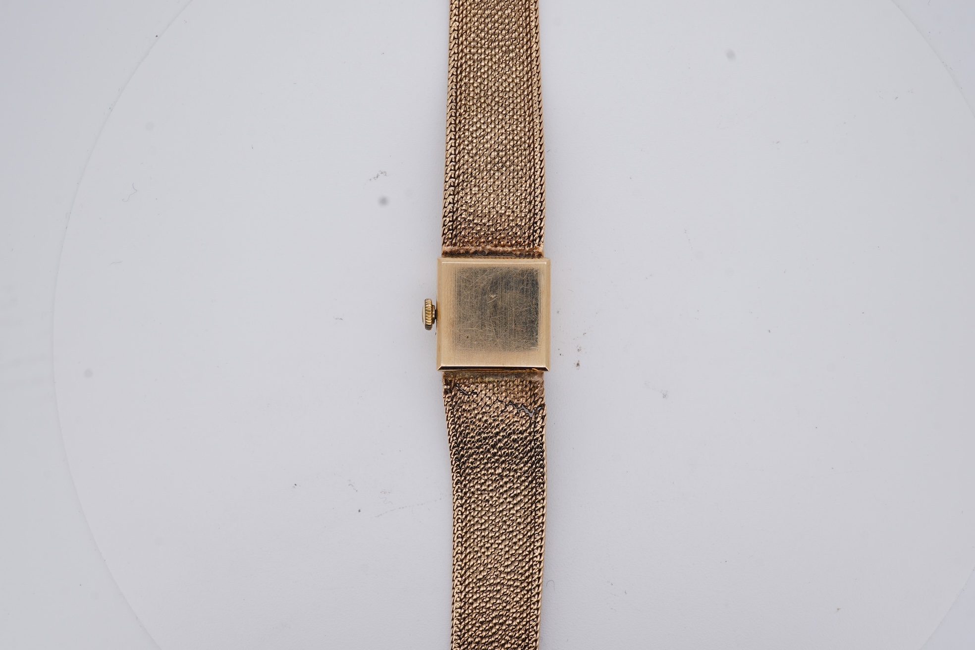 A lady's 1960's 9ct gold Rolex Precision manual wind wrist watch, with square dial, on an integral 9ct gold bracelet, the clasp with Rolex crown, overall length 15cm, gross weight 22 grams (bracelet a.f.)